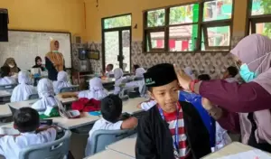 Siswa MIN 2 Kota Malang Terima Rapor Kesehatan Setelah Ikuti Pemeriksaan Gratis